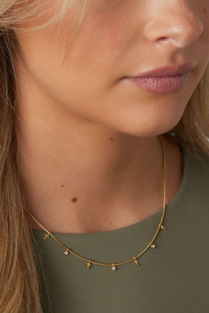 Ketting met steentjes en kruisjes
