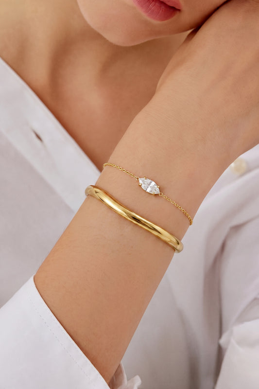Fijne schakelarmband met oogvormige strass steen